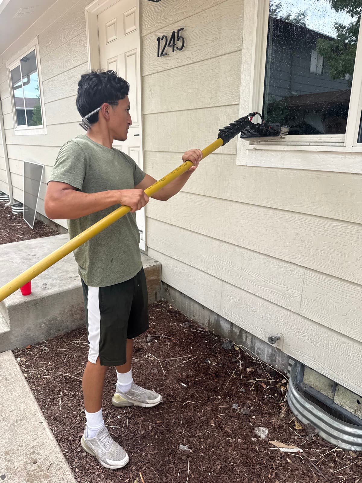 Soft-washing siding safely from the ground