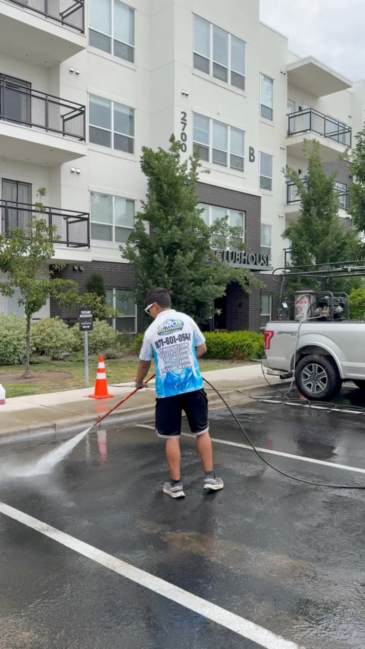 Rotary surface cleaner on a commercial lot β driveway and flatwork cleaning near Eagle