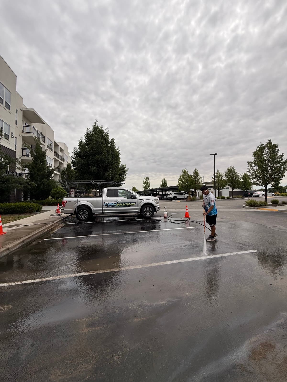 Commercial flatwork being pressure washed to like-new