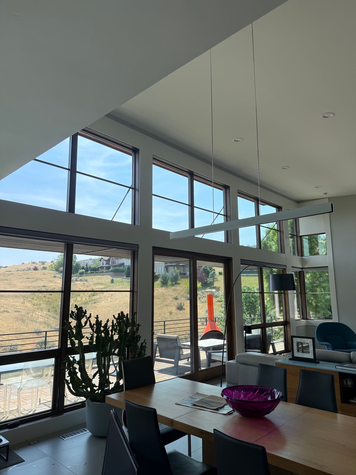 Modern living room windows with a clear foothills view